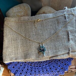 Elegant Gold Necklace with Black Pendant